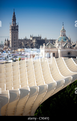 The Giralda tower (left) and El Salvador dome (right) as seen from the top of Metropol Parasol (foreground), Seville, Spain Stock Photo