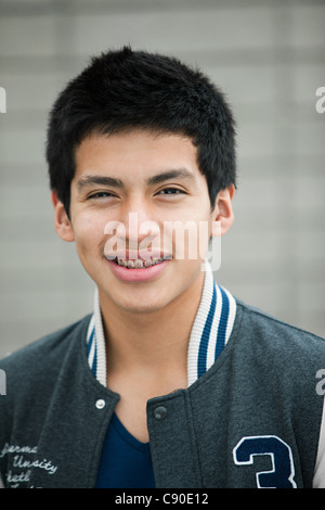 Young man wearing baseball jacket, portrait Stock Photo