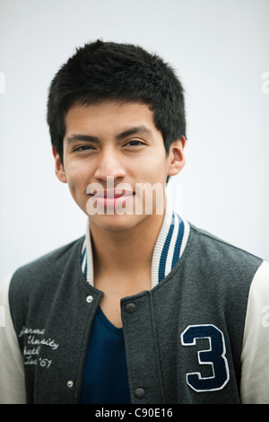 Young man wearing baseball jacket, portrait Stock Photo