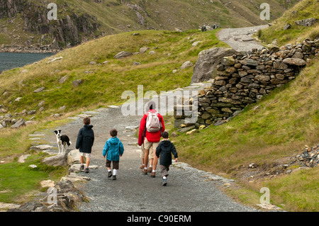 Family walking the Miners Track towards Mt. Snowdon, Snowdonia National Park, Wales, UK Stock Photo