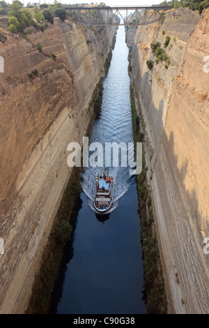 Tourist boat on the Corinth Canal which connects the Gulf of Corinth with the Saronic Gulf in the Aegean Sea Stock Photo