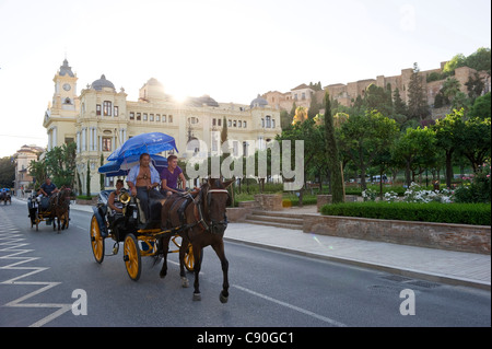 Horse-drawn carriages in front of Alcazaba fortress and town hall, Malaga, Andalusia, Spain, Europe Stock Photo
