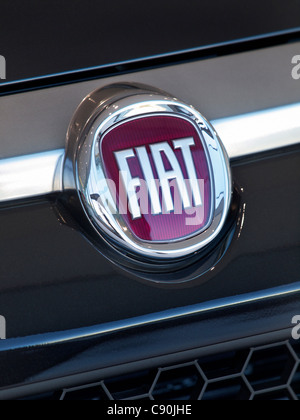 Fiat logo badge on the front of a Fiat Punto car. Fiat is an acronym and stands for Fabbrica Italiana Automobili Torino Stock Photo