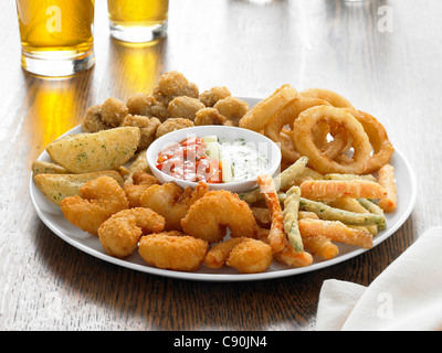 sharing plate of nibbles and dip Stock Photo