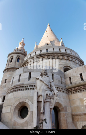 View of the Fisherman's Bastion and a statue on the half landing form below, Budapest, Hungary Stock Photo