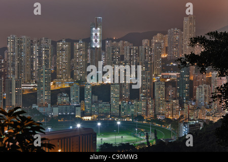 Hongkong Skyline and Wan Chai at night, Happy Valley Sports Ground, Hong Kong, China Stock Photo