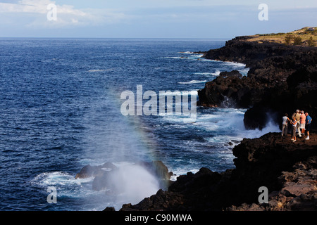 People on the waterfront, Blowing Holes near Saint Leu, La Reunion, Indian Ocean Stock Photo