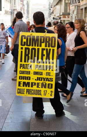 Man carrying advertising sandwich board 'Buy Rolex' Madrid Spain Europe Stock Photo