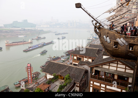 Yangzi, Yang-tse, Changjiang river with ship and boats, opera in the background, Chongqing, People's Republic of China Stock Photo