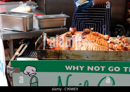 Whole cooked pig outdoors at the Birmingham International Food Fair 2011. Stock Photo