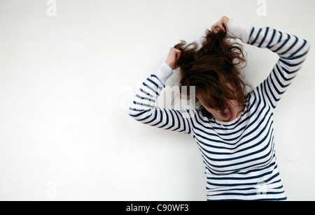 Woman pulling her hair. Stock Photo