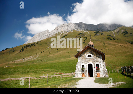 There are small mountain shrines and chapels on the slopes of the French Alps. Haute Savoie, France. Stock Photo