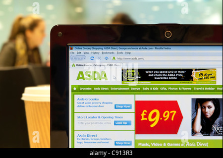 The Asda website shot in a coffee shop environment (Editorial use only: print, TV, e-book and editorial website). Stock Photo
