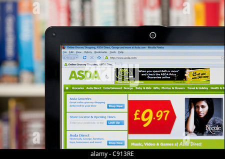 The Asda website shot against a bookcase background (Editorial use only: print, TV, e-book and editorial website). Stock Photo