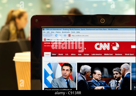 The CNN website shot in a coffee shop environment (Editorial use only: print, TV, e-book and editorial website). Stock Photo