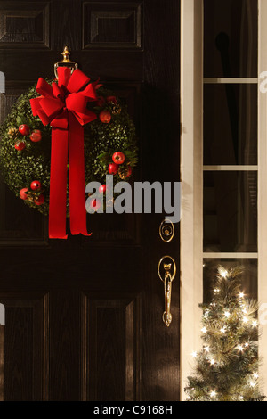 Christmas wreath on front door of home, USA Stock Photo
