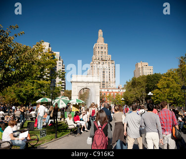 Washington Square park is a popular public park surrounded by New York University buildings. The centre of the square is Stock Photo