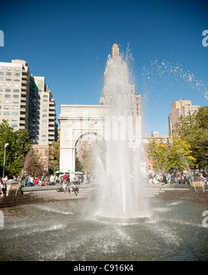 Washington Square park is a popular public park surrounded by New York University buildings. The centre of the square is Stock Photo