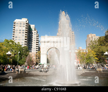 Washington Square park is a popular public park surrounded by New York University buildings. The centre of the square is Stock Photo