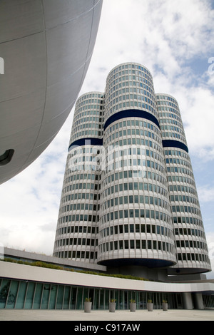 The main attraction for the hundreds of thousands of visitors that visit BMW yearly is the four-clinder BMW tower and the Stock Photo