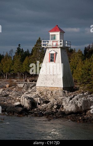 A ray of sunlight strikes the lighthouse at South Baymouth, Manitoulin Island, Ontario. Stock Photo