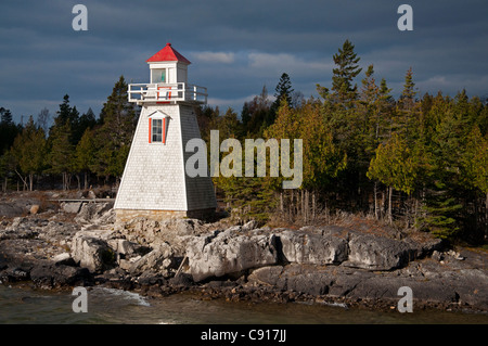 A ray of sunlight strikes the lighthouse at South Baymouth, Manitoulin Island, Ontario. Stock Photo