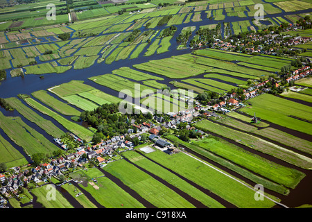 Netherlands, Wormer, Polder with village and farmland. Aerial. Stock Photo