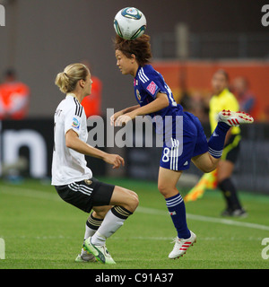 Aya Miyama of Japan (R) wins the ball against Bianca Schmidt of Germany (L) during a 2011 Women's World Cup quarterfinal match. Stock Photo