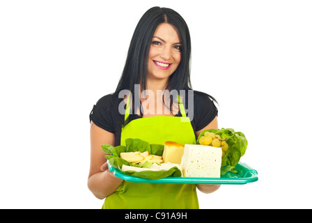 Smiling cheesemaker woman holding plateau with cheese isolated on white background Stock Photo