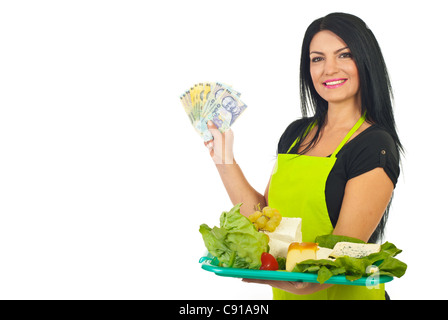 Smiling cheesemaker with different cheese on plateau showing money banknotes isolated on white background Stock Photo