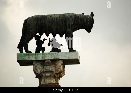 Statues showing the mythological origins of Roman society in which a wolf suckles founders Romulus and Remus stand in many Stock Photo