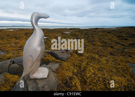 A memorial to the Great Auk, a statue of a bird, stands on Reykjavik seafront. Stock Photo