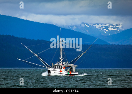 A fishing boat sailing near Chichagof Island, Glacier Bay National Park & Preserve, Southeast Alaska, Summer Stock Photo