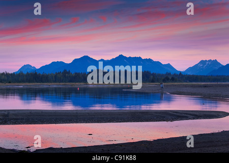 Scenic of mountains reflecting in the mouth of the Salmon River and Gustavus Beach at sunrise, Glacier Bay National Park, Alaska Stock Photo