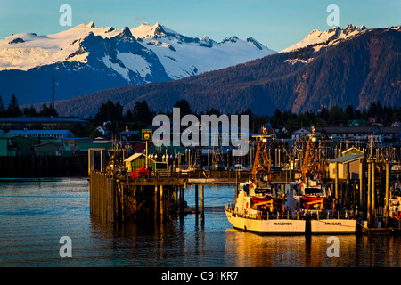 Sunset over North Harbor and snowcapped coastal mountains, Petersburg, Southeast Alaska, Summer Stock Photo
