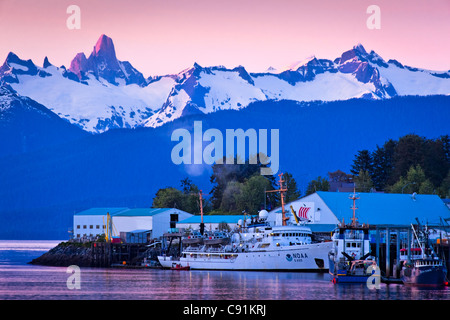 Sunset over North Harbor with alpenglow on coast mountains and Devils Thumb, Petersburg, Southeast Alaska, Summer Stock Photo