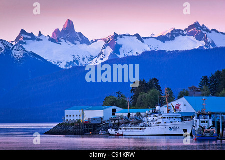 Sunset over North Harbor with alpenglow on coast mountains and Devils Thumb, Petersburg, Southeast Alaska, Summer Stock Photo