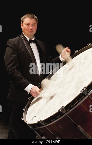 Bass drum player in orchestra Stock Photo