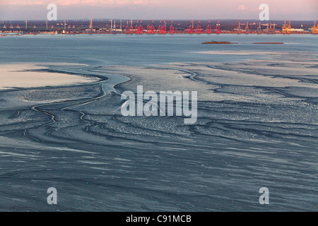 Aerial view of mudflats, mouth of the River Weser and harbour cranes, Bremerhaven, Bremen, Germany Stock Photo
