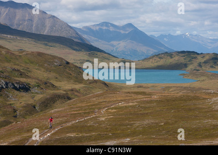 Scenic view of mountain biker on the Lost Lake Trail with Lost Lake in the background, Kenai Peninsula, Southcentral Alaska Stock Photo