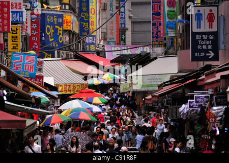 Namdaemun has a large market, with the narrow streets crowded with stalls selling food and consumer goods. Stock Photo