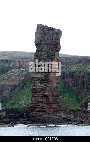 'The Old Man of Hoy' is a sandstone sea stack off the coast of the Orkneys in Scotland. Stock Photo