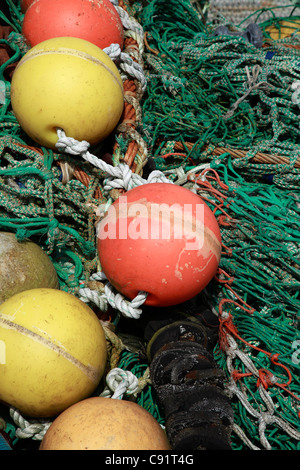 Fishing nets and floats on the quay at Stromness, the second largest town on Orkney, Scotland. Stock Photo