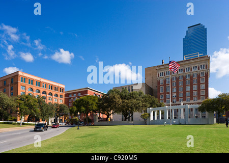 Site of the Kennedy assassination looking towards Dealey Plaza with old Texas Schoolbook Depository to left, Dallas, Texas, USA. Stock Photo