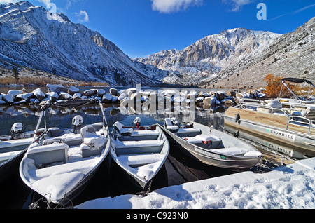 Boat dock covered in snow at Convict Lake near Mammoth Lakes California Stock Photo