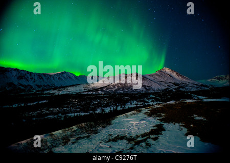 The Northern Lights over Wolverine Peak in the Chugach State Park near Powerline Pass, Anchorage, Southcentral Alaska, Winter Stock Photo