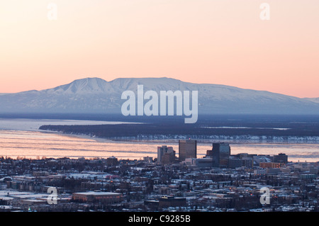 Aerial view of the downtown Anchorage skyline with Mt. Susitna (Sleeping Lady) and Cook Inlet in the background, Alaska, Winter Stock Photo