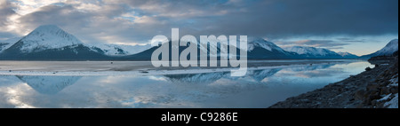 Scenic panorama of the Kenai Mountains reflected in Turnagain Arm, Southcentral Alaska, Winter Stock Photo