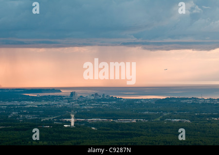 Aerial view of downtown Anchorage in a late summer evening with a rainstorm in the background, Alaska Stock Photo