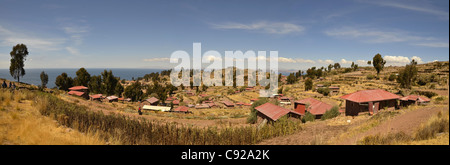 housing poor view lake titicaca house roof sky poverty basic blue cloud highest navigable taquile island puno horizon bright day Stock Photo